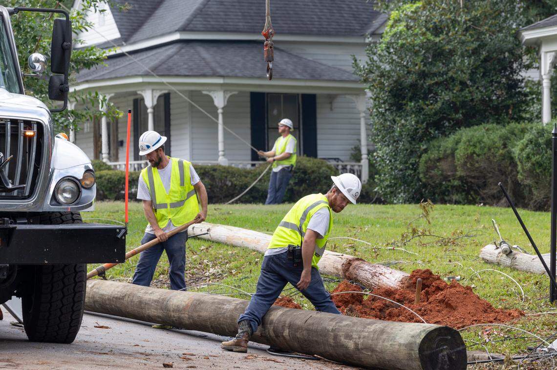 Utility lineman work to replace power poles and lines in Newberry after strong winds and rain blew through from Hurricane Helene on Monday, Sept 30, 2024.