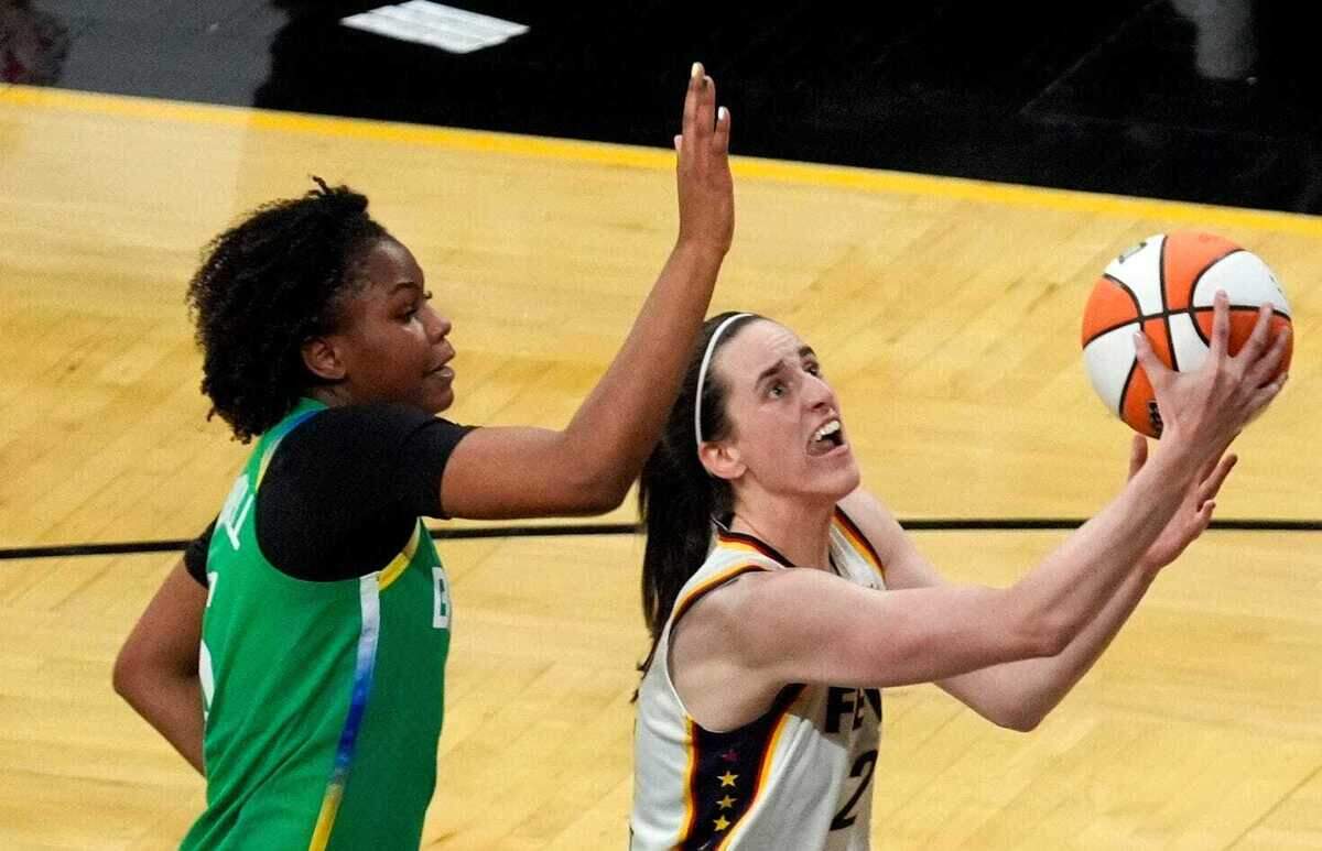 Indiana Fever guard Caitlin Clark (22) shoots against BrazilÕs Ayla McDowell (5) during an WNBA game May 4, 2025 at Carver-Hawkeye Arena in Iowa City, Iowa.
