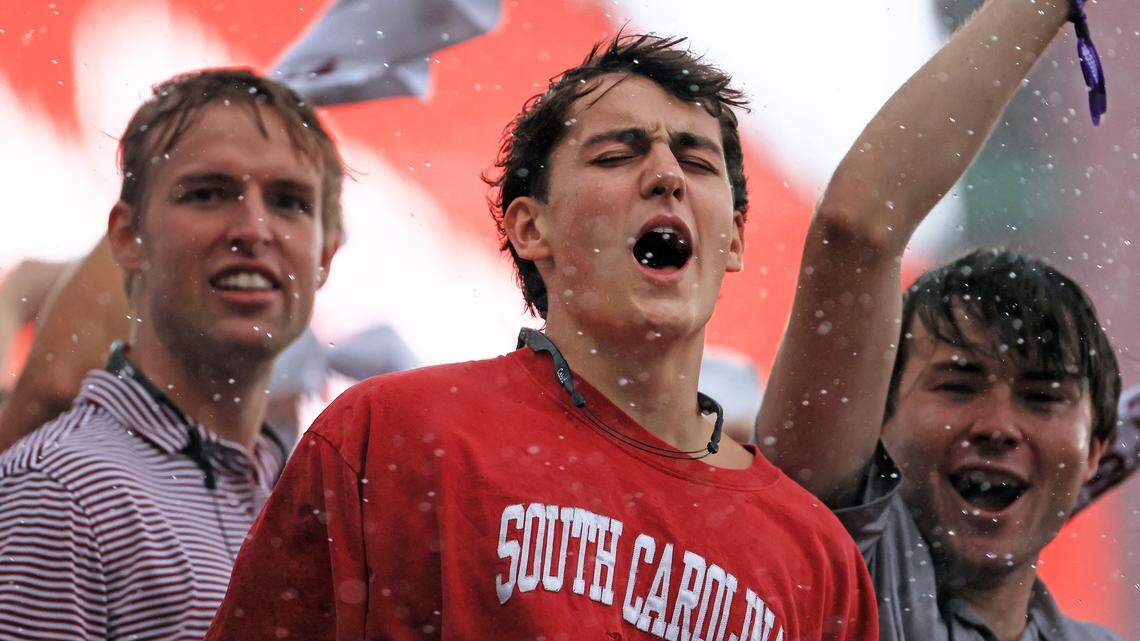 The South Carolina student section sticks out the heavy rain and weather delay Saturday.