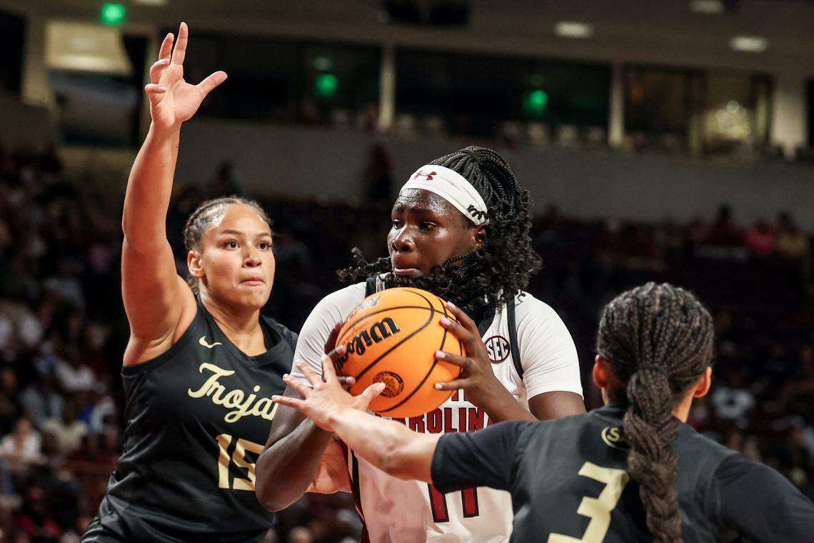 University of South Carolina's Madina Okot (11) drives to the basket as Anderson's Rose Gravel (15) and Jayla Cal (3) pressure during the first half of action at the Colonial Life Arena on Friday Oct. 24, 2025.