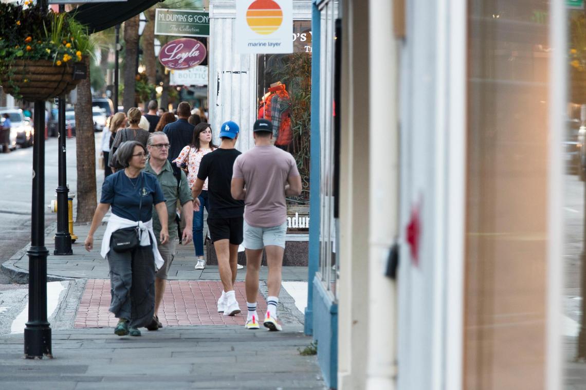 People shop in Charleston, South Carolina on Saturday, October 23, 2021.