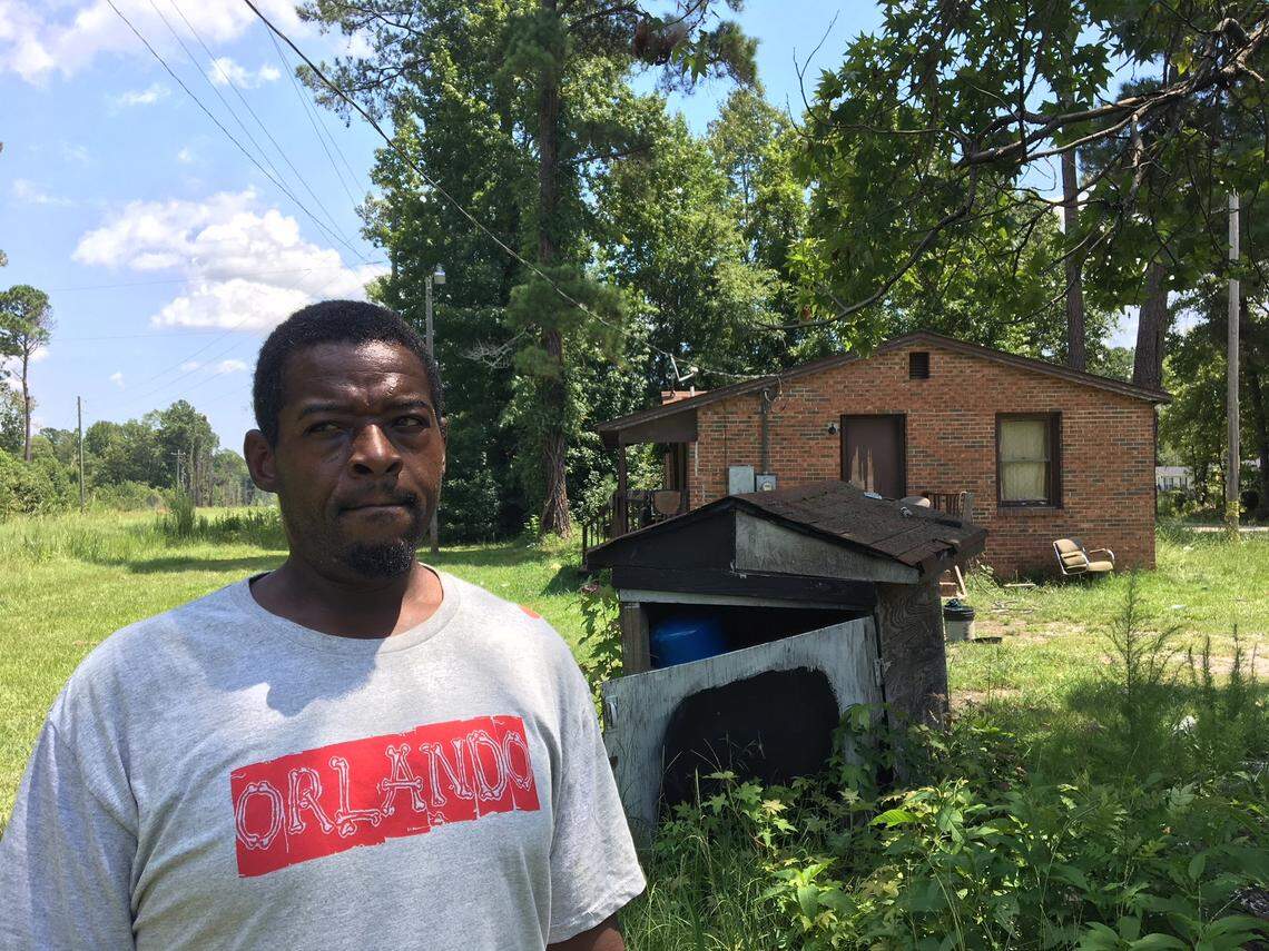 Lower Richland residents worry about how groundwater pollution from a nearby Westinghouse nuclear fuel factory will affect their drinking water. Michael Daugherty is pictured in front of the well house at his home on Old Bluff Road. State regulators say wells are not in danger, but critics are skeptical.