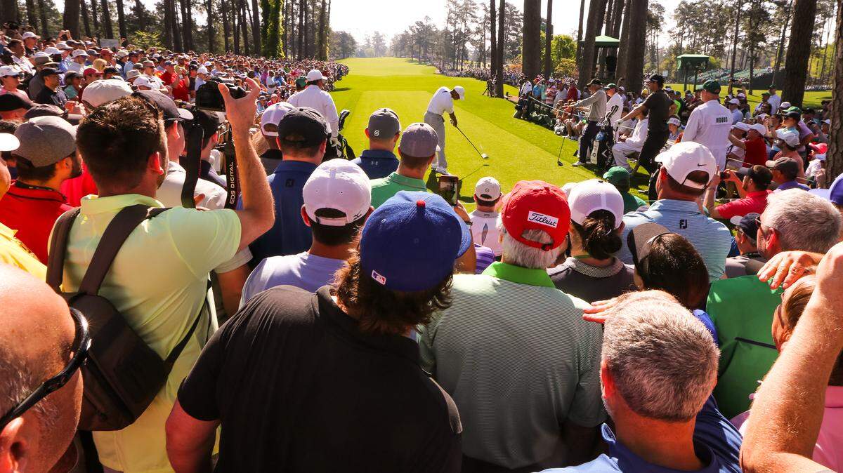 Tiger Woods hits his tee shot from the 17th green during Tuesday's practice round for the 2018 Masters. Will fans in Charlotte get to see a similar sight at the Wells Fargo Championship in early May?
