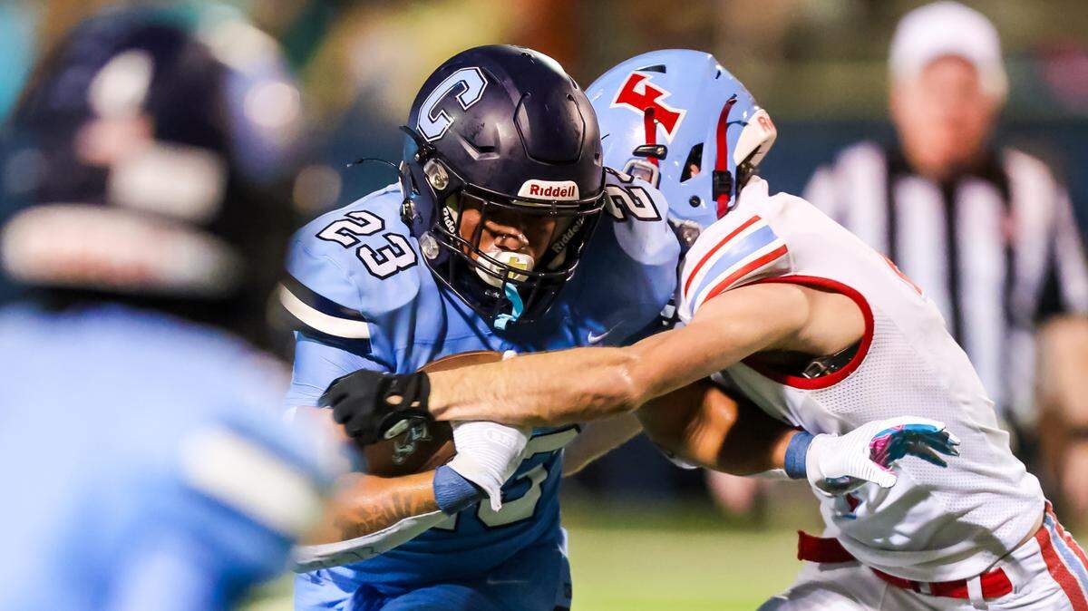 AC Flora Falcons Michael Quinn (4) strips Chapin Eagles running back Colione Martin (23) of the ball, forcing a fumble, during their game at Chapin High School Friday, 8/30/24.