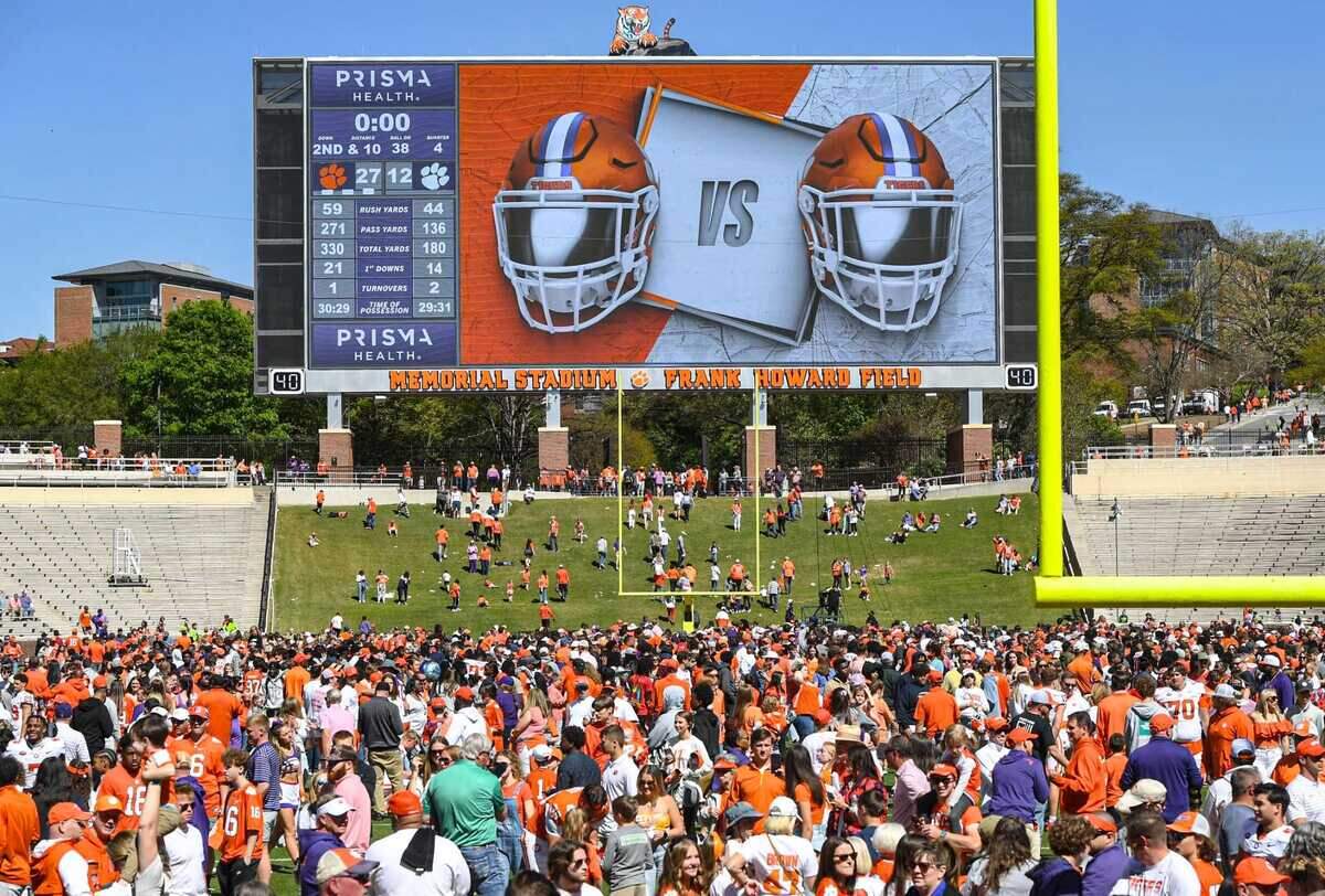 Clemson fans run on the field for meet me at the paw after the Spring football game in Clemson, S.C. Saturday, April 6, 2024.