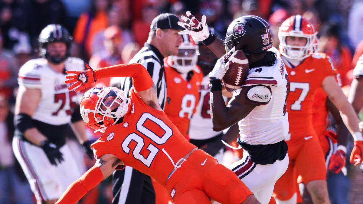 Clemson cornerback Avieon Terrell (20) breaks up the pass to South Carolina wide receiver Nyck Harbor (8) during the first half of the Palmetto Bowl between South Carolina and Clemson at Memorial Stadium in Clemson on Saturday, November 30, 2024.