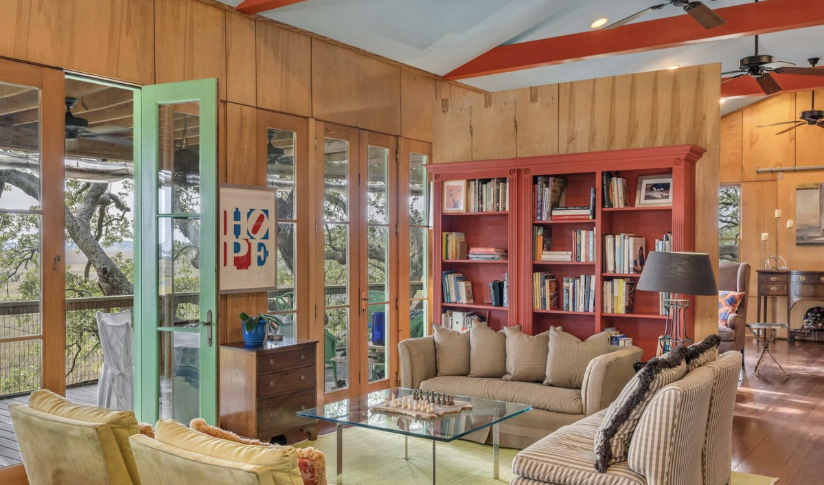 The house has many porches and vivid colors throughout.