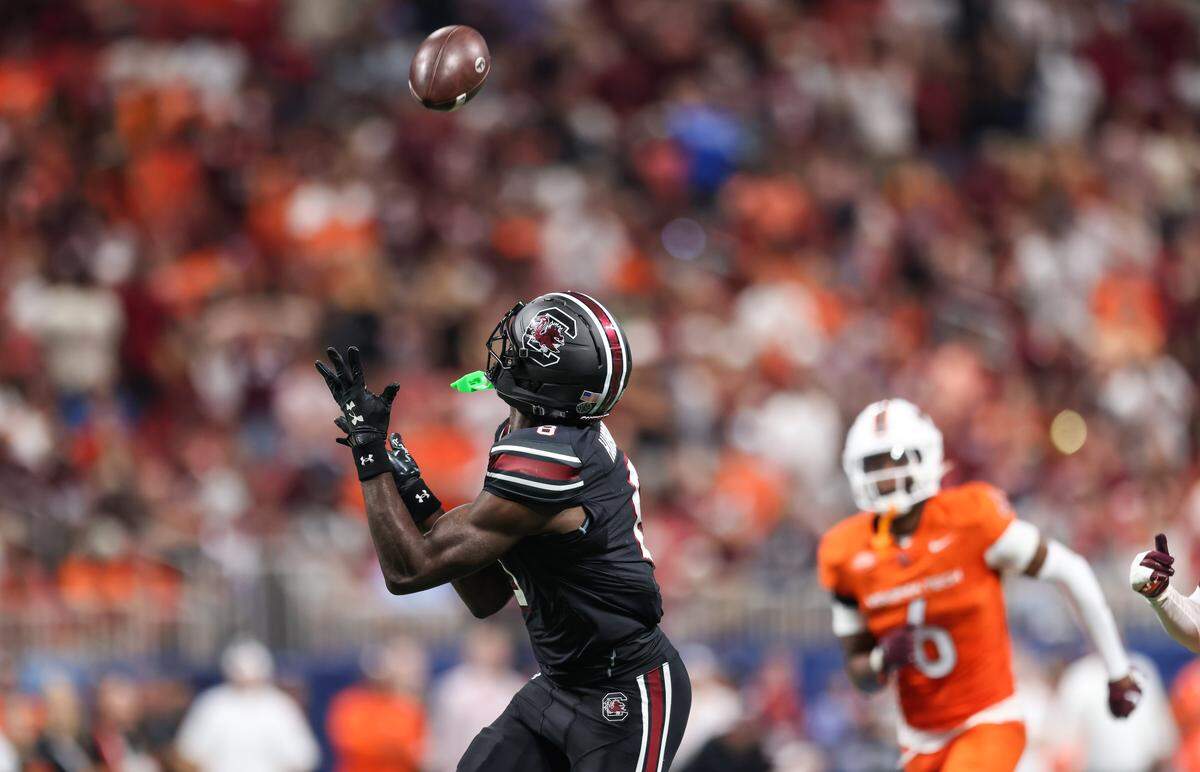 South Carolina wide receiver Nyck Harbor (8) hauls in a pass for a touchdown Sunday at Mercedes-Benz Stadium in Atlanta. The Gamecocks and Hokies faced off Aug. 31 in the 2025 Aflac Kickoff Game.