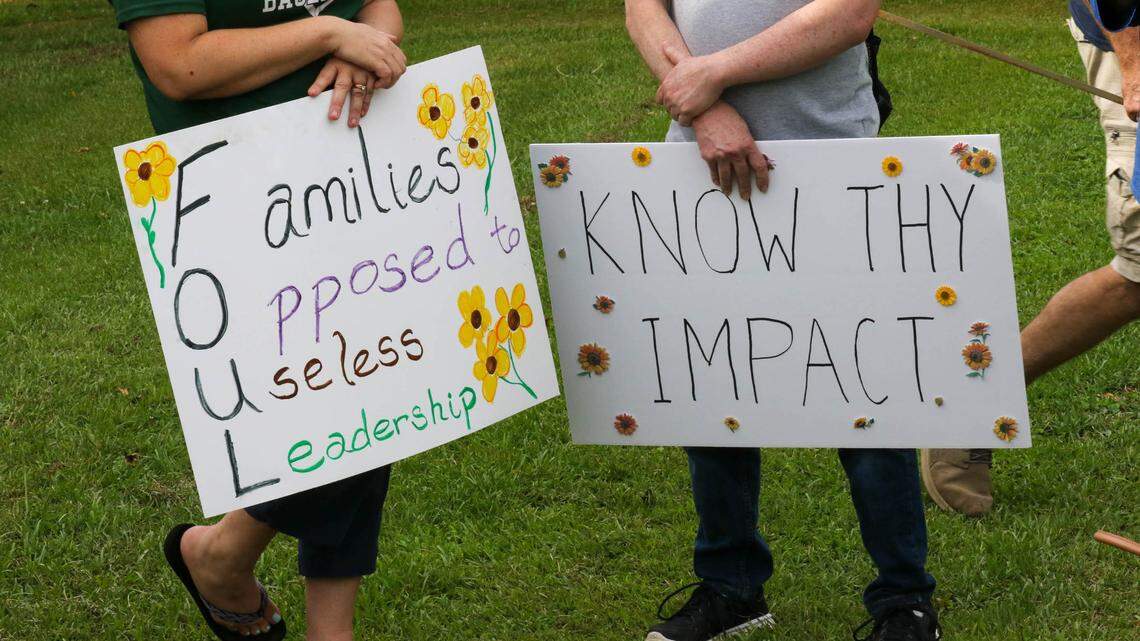Supporters of former LR District 5 superintendent Christina Melton gather at the district office to show support for her.