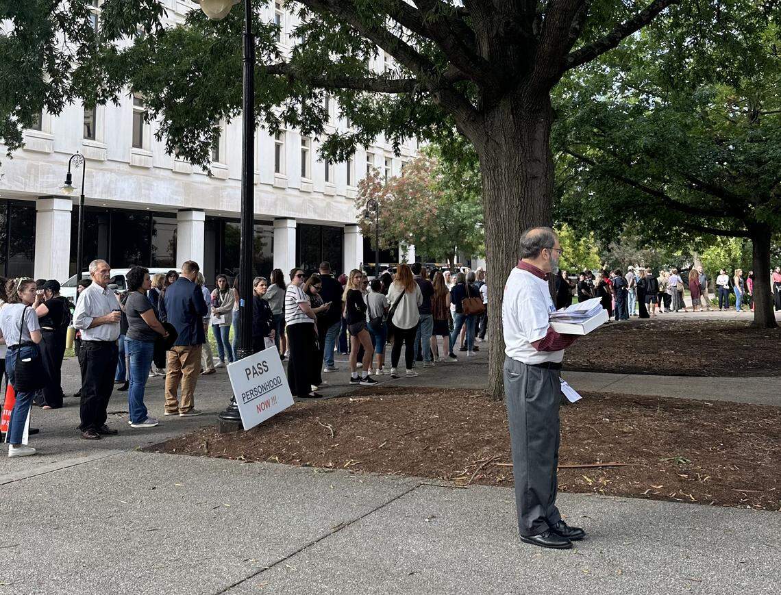 Attendees line up to enter the building where lawmakers heard testimony on a near total abortion ban Wednesday, Oct. 1, 2025 in Columbia.