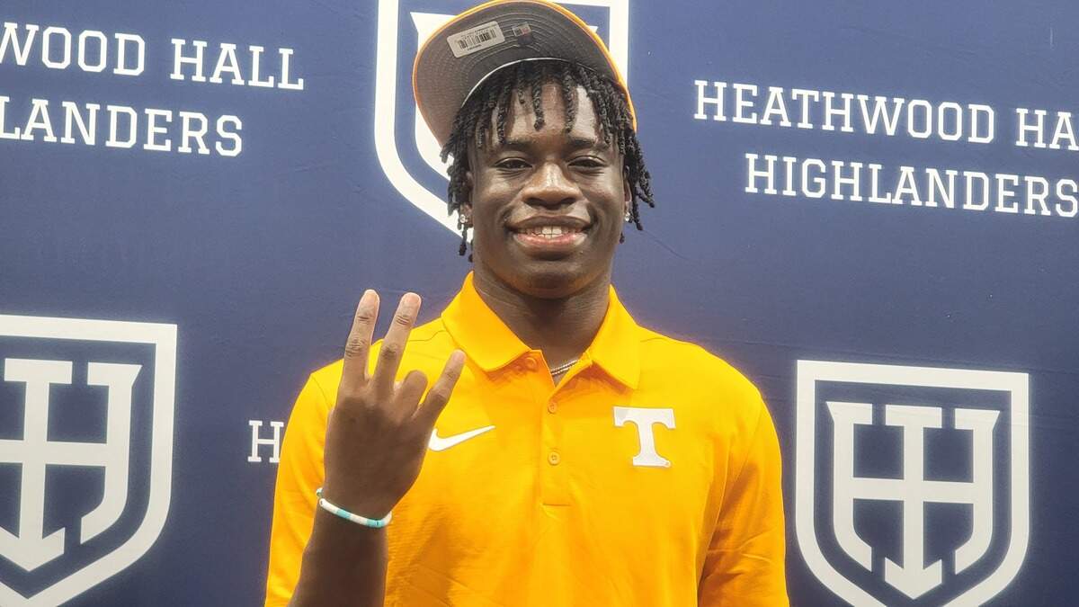 Heathwood Hall Onis Konanbanny with the Tennessee Vols symbol after committing to play football for them on Aug. 23, 2024.