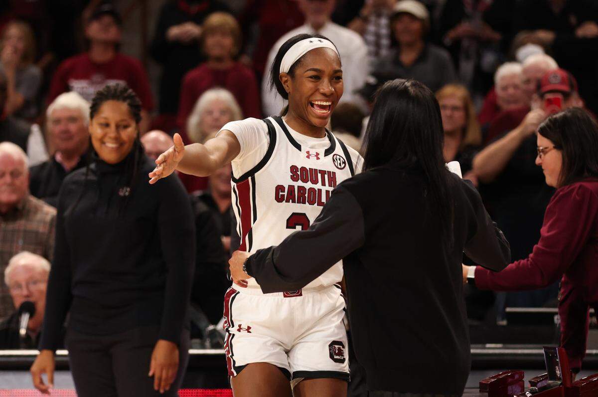 South Carolina guard Bree Hall (23) gets a hug from head coach Dawn Staley while being awarded her 2022 ring following the Gamecocks’ game against the visiting Terrapins at Colonial Life Arena on Sunday, November 12, 2023.