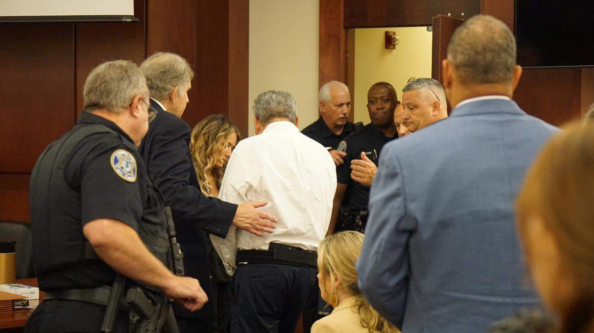 Greg Leon is led from the Lexington County Courtroom after being found guilty of murdering his wife’s lover Arturo Bravo Santos on July 6, 2023.