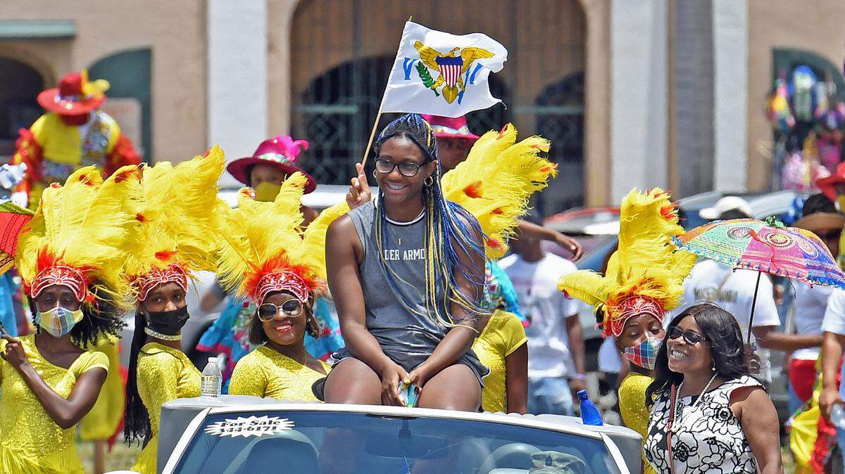 Trailed by dancers and moko jumbies, South Carolina forward and St. Thomas native Aliyah Boston leads the “Aliyah Boston Day” parade Saturday down Veterans Drive in downtown Charlotte Amalie, St. Thomas, U.S. Virgin Islands.