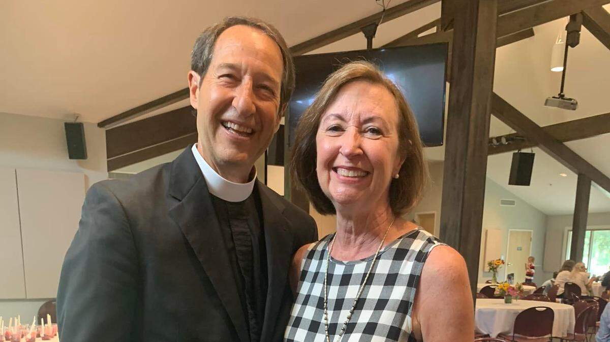 The Rev. Greg and Meredith Kronz pose for snapshots at a farewell brunch in the St. Luke’s Church fellowship hall on Sunday, Aug. 28, 2022. “We have never known each other outside of a shared ministry,” he said.