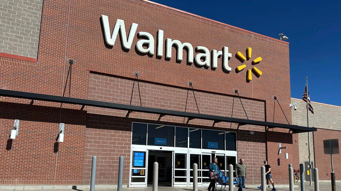 Shoppers exit a Walmart store Wednesday, Feb. 21, 2024, in Englewood, Colorado.