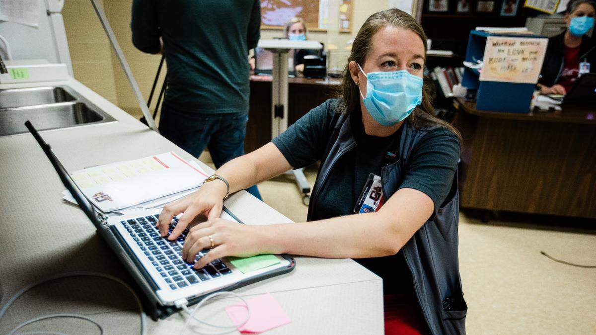 School nurse Elizabeth Clark working at Gilbert High School during the latest surge in COVID-19 case numbers in Midlands schools on Friday, Sept. 17, 2021.