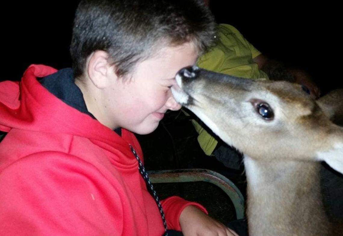 George the deer and Kaleb Funderburk share a moment.