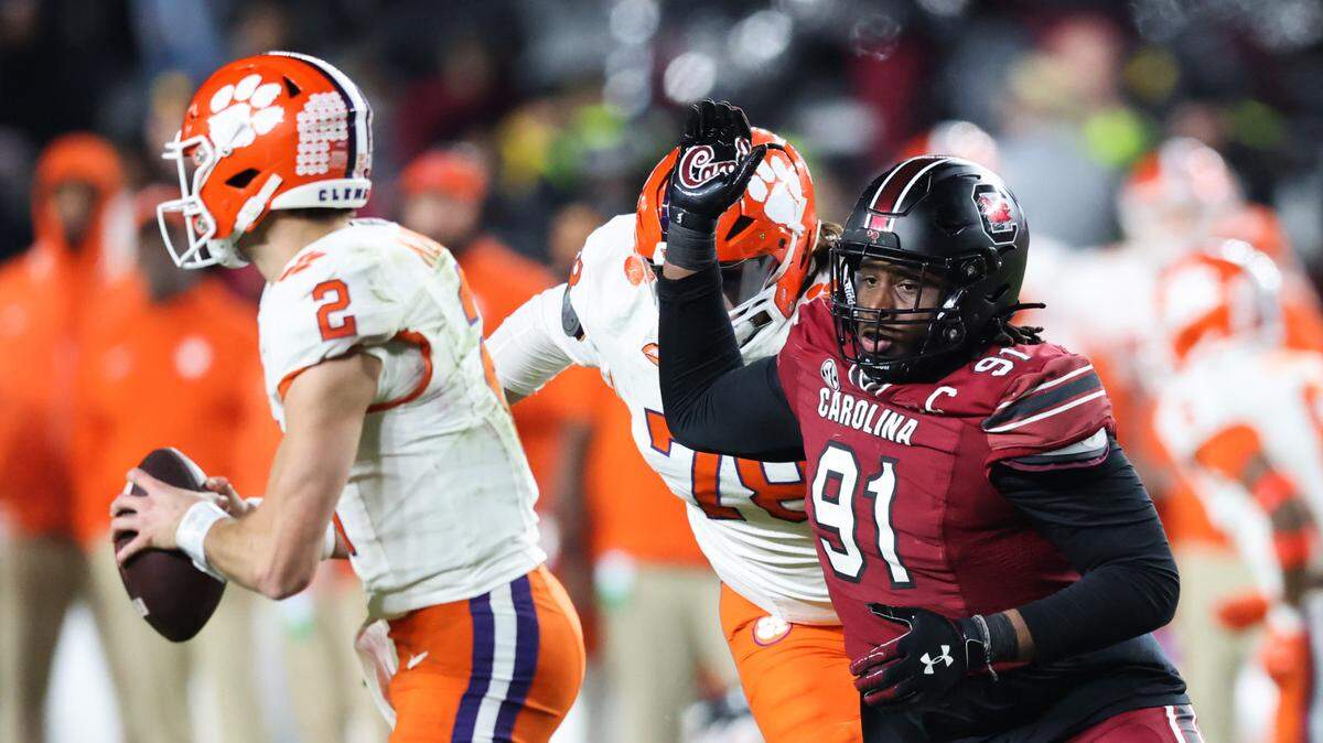 South Carolina defensive tackle Tonka Hemingway (91) chases down Clemson quarterback Cade Klubnik (2) during the first half of South Carolina’s game against Clemson at Williams-Brice Stadium in Columbia on Saturday, November 25, 2023.