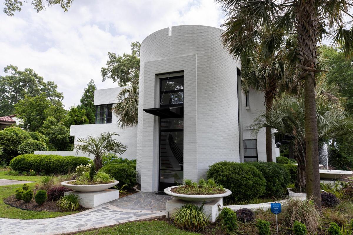 This distinctive home across from St. Joseph Church was designed by architect Beau Clowney. Owner Kevin Fisher worked with an art director to design the primary color rich interior.