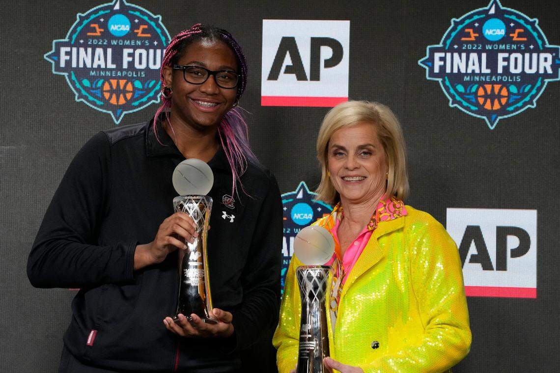 South Carolina’s Aliyah Boston and LSU head coach Kim Mulkey pose with their the AP Player and Coach of the Year awards at a news conference at the Women’s Final Four NCAA tournament Thursday, March 31, 2022, in Minneapolis.