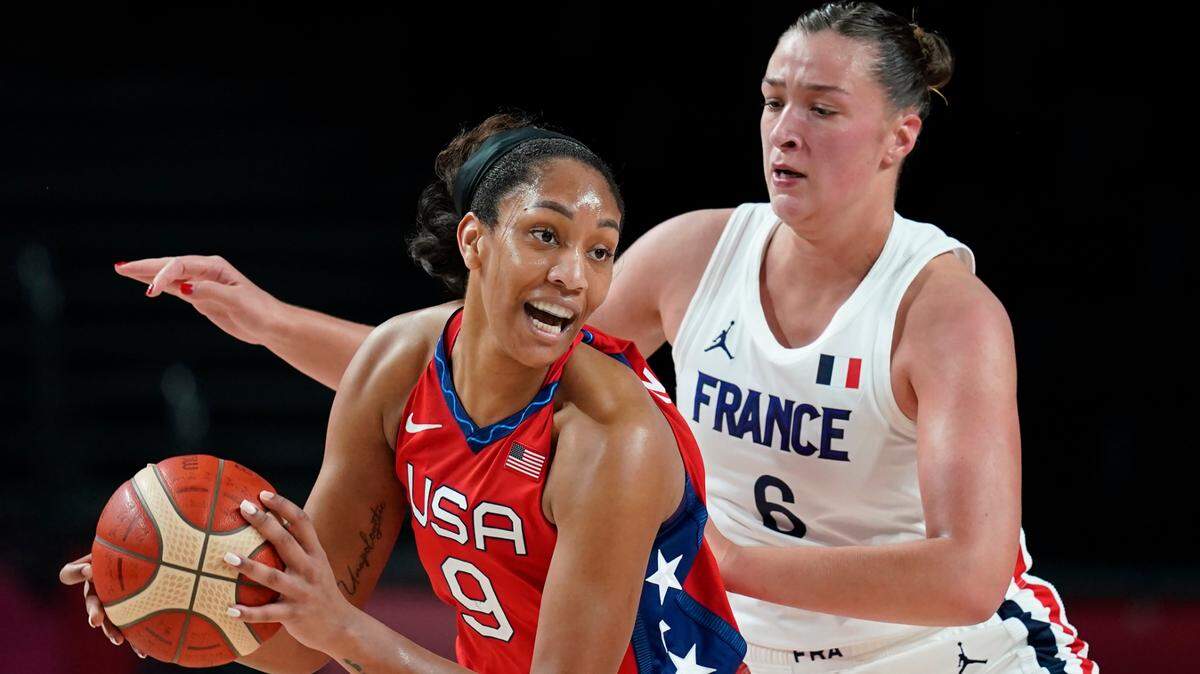 United States’ A’Ja Wilson (9) drives around France’s Alexia Chartereau (6) during women’s basketball preliminary round game at the 2020 Summer Olympics, Monday, Aug. 2, 2021, in Saitama, Japan. (AP Photo/Charlie Neibergall)