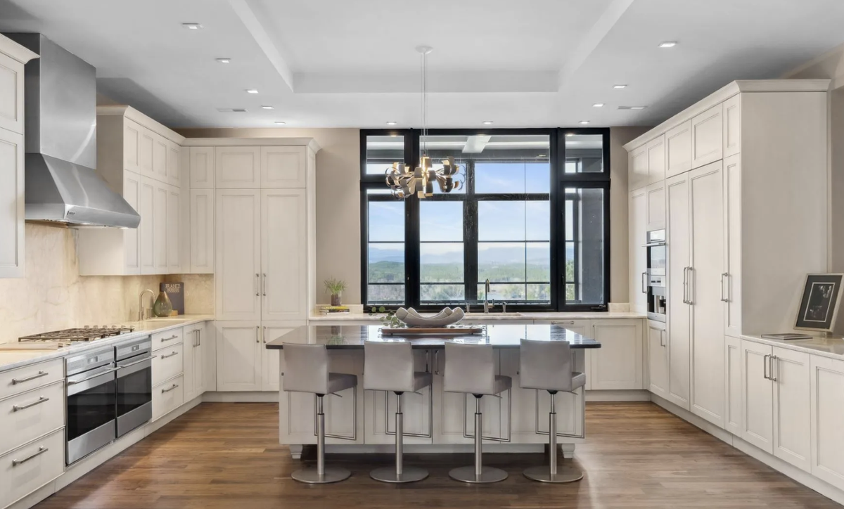 The kitchen includes upscale appliances and a butler’s pantry.