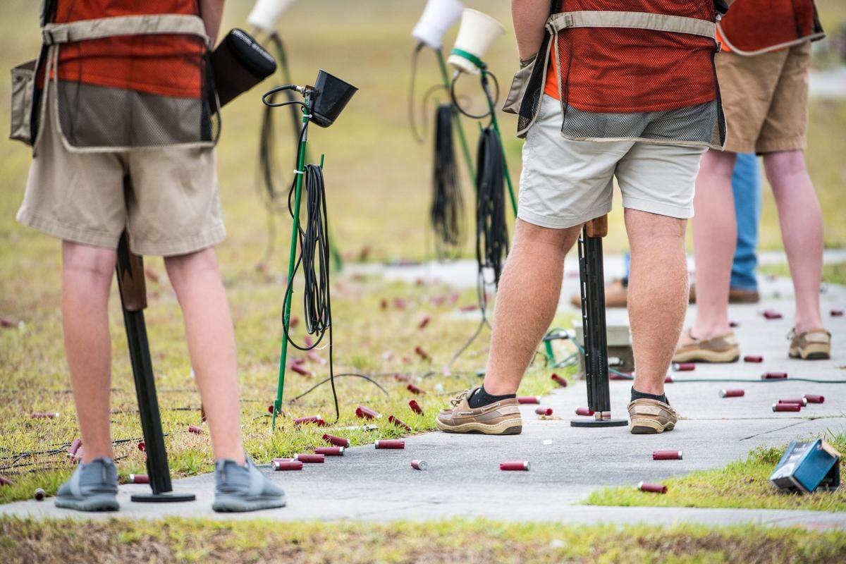 Shotgun shells surround students from Conway High School at the Mid-Carolina Gun Club during the South Carolina State High School Clay Target League championships Saturday, June 8, 2019, in Orangeburg, S.C.