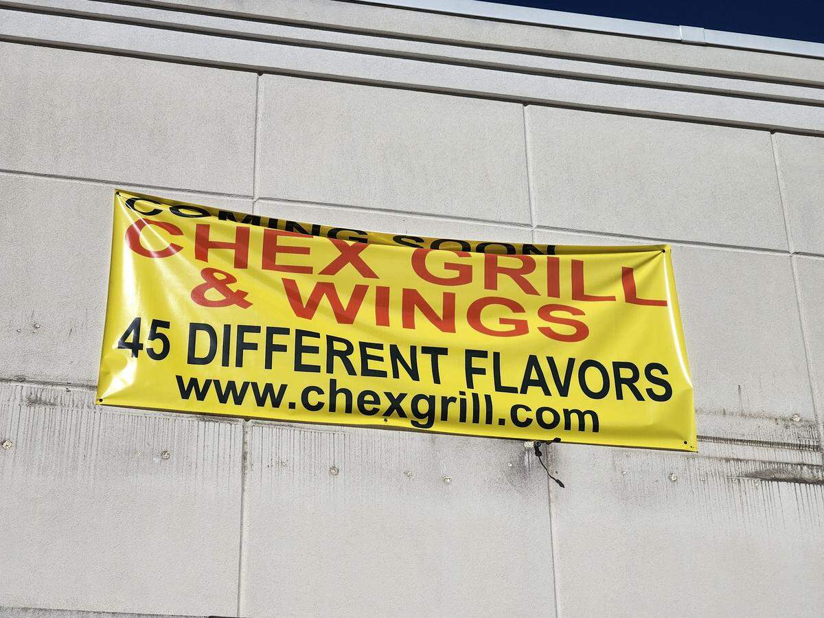A banner announces that a Chex Grill & Wings is coming soon to 275 Park Terrace Drive in Columbia’s Harbison area.