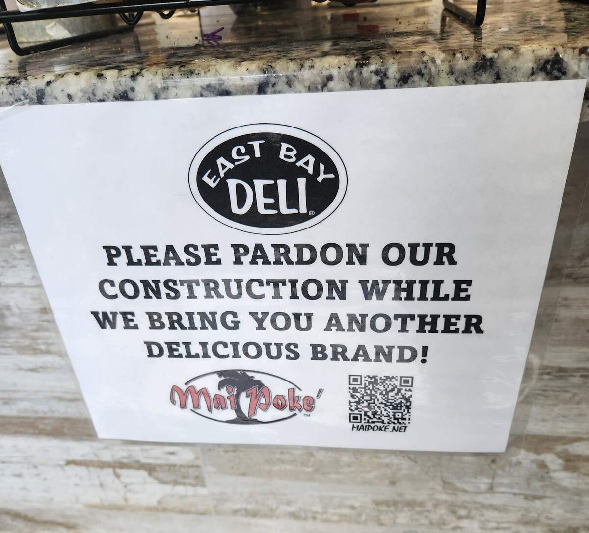 A sign at East Bay Deli at 1426 Main St. in Columbia touts that Mai Poke also is coming to the space.