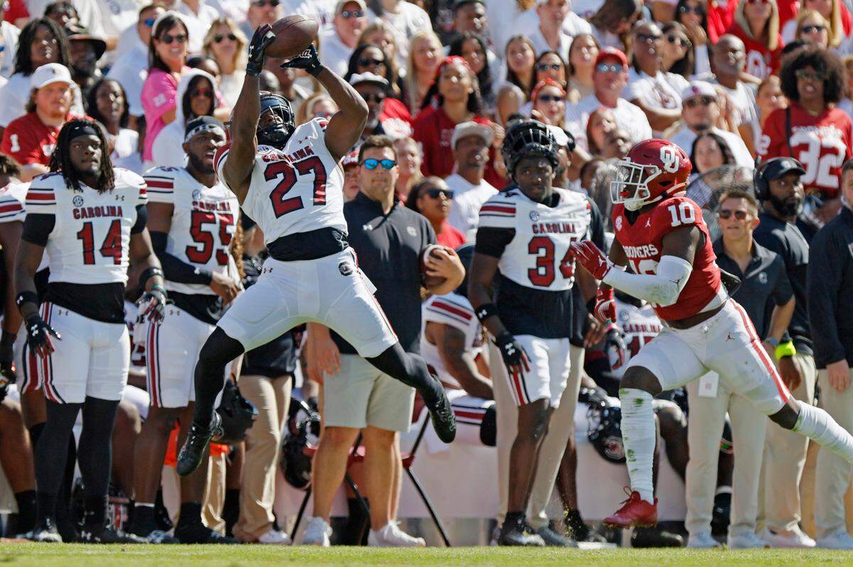 South Carolina’s Oscar Adaway III (27) makes a catch in the second quarter near Oklahoma’s Kip Lewis (10), Saturday, Oct. 19, 2024, at Gaylord Family - Oklahoma Memorial Stadium in Norman, Okla.