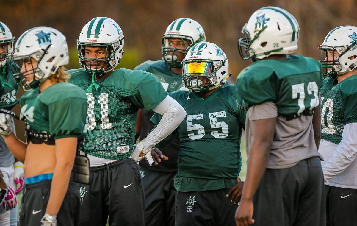 Dutch Fork center, Jalen McDuffie (55) and his fellow offensive linemen practice for the Class 5A football championship Friday. 12/4/18