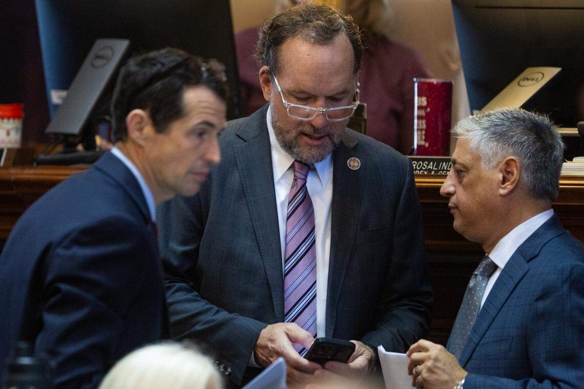 Ways and Means Budget Director Marc Truesdale, Ways and Means Chairman Representative Bruce Bannister, R-Greenville and Representative Leon Stavrinakis, D-Charleston, speak as house members debate amendments to the state budget on Tuesday, March 11, 2025.