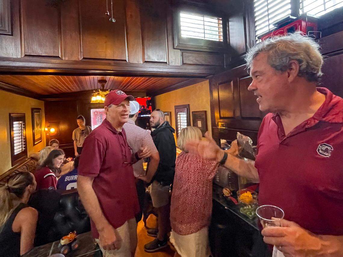 Joe Boland, left, and John Green chat inside their Cockaboose while entertaining before the USC game against LSU on Saturday, Sept. 14, 2024.