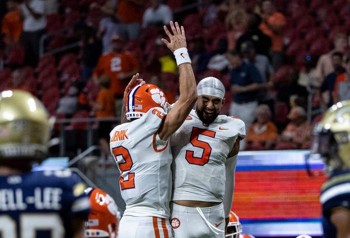 Clemson Tigers quarterback Cade Klubnik (2) and Clemson Tigers quarterback DJ Uiagalelei (5) celebrate during the second half of the Chick-fil-A Kickoff Game, Monday, Sept. 5, 2022, in Atlanta. (Vasha Hunt via Abell Images for the Chick-fil-A Kickoff Game)
