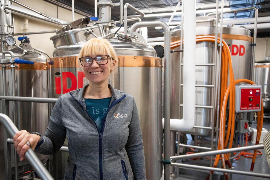 Ashley Kinart-Short, the brewmaster of Peak Drift in front of the brewing tanks at Smoked, a new restaurant on Main Street in Columbia, South Carolina, on Thursday, November 4, 2021.