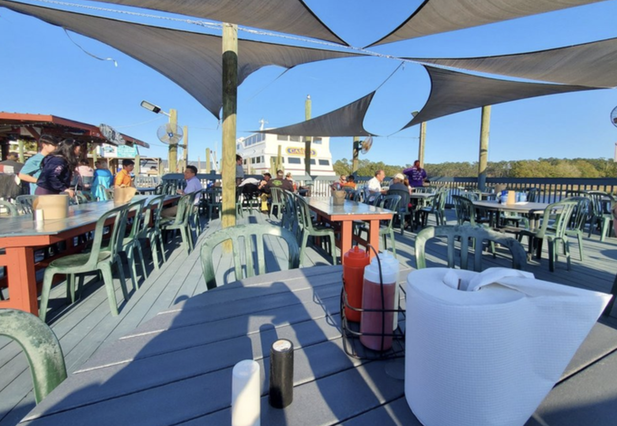 Crab Catchers’ tagline. The restaurant is located on a dock over the Intracoastal Waterway in the northernmost community on South Carolina’s coast.