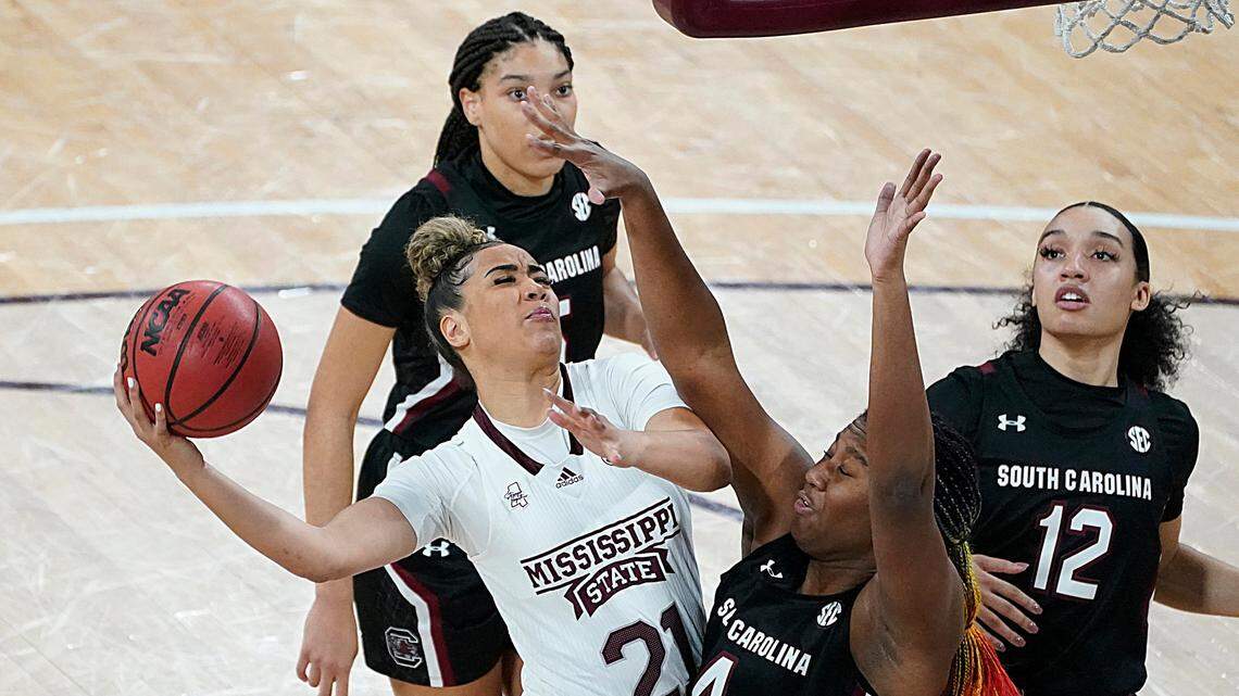 Mississippi State guard Madison Hayes (21) shoots while defended by South Carolina forward Aliyah Boston (4) during the first half of an NCAA college basketball game in Starkville, Miss., Thursday, Jan. 28, 2021. (AP Photo/Rogelio V. Solis)