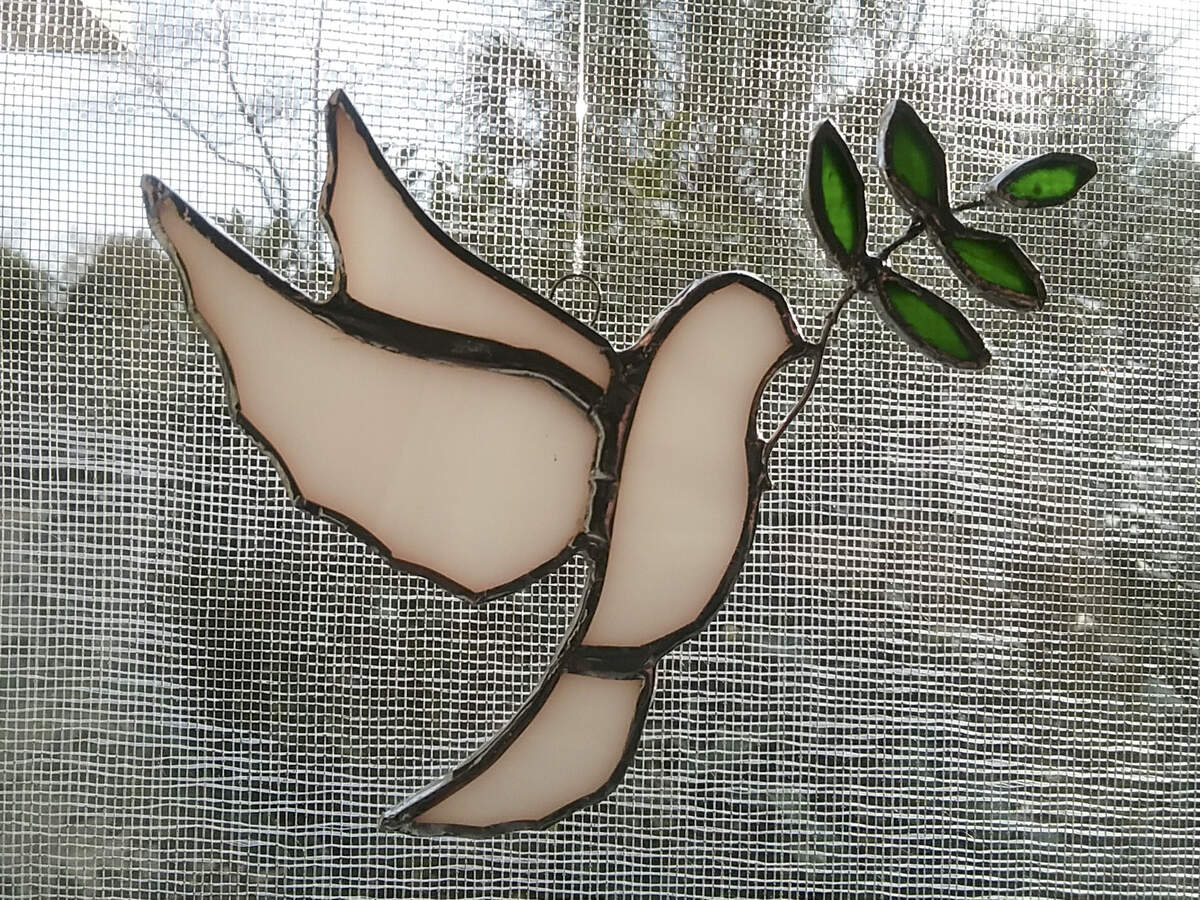 Stained-glass dove created by artist Dana Hawthorne of Pinopolis. She presented it as a gift to the Buddhist monks during their Walk for Peace in Saluda, S.C.