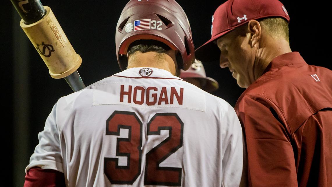 South Carolina Gamecocks head coach Mark Kingston (17) and South Carolina Gamecocks designated hitter Riley Hogan (32) confer against the Tennessee Volunteers at Founders Park.