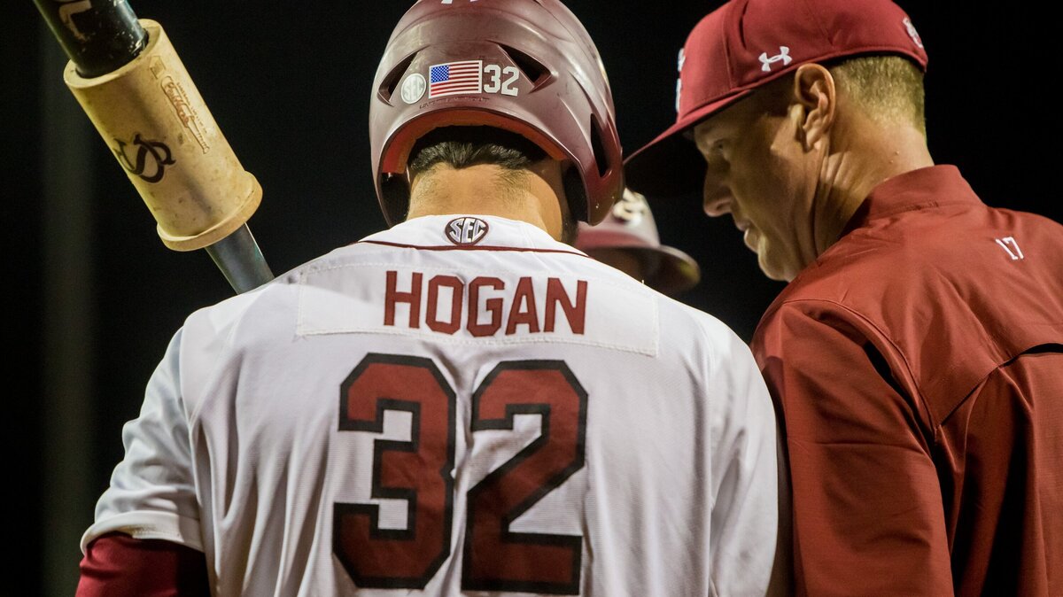 South Carolina Gamecocks head coach Mark Kingston (17) and South Carolina Gamecocks designated hitter Riley Hogan (32) confer against the Tennessee Volunteers at Founders Park.