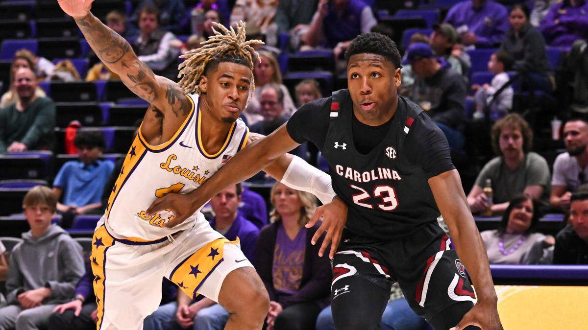 LSU guard Adam Miller (44) defends against South Carolina forward Gregory “GG” Jackson II (23) during an NCAA college basketball game, Saturday, Feb. 18, 2023, in Baton Rouge, La. (Hilary Scheinuk/The Advocate via AP)