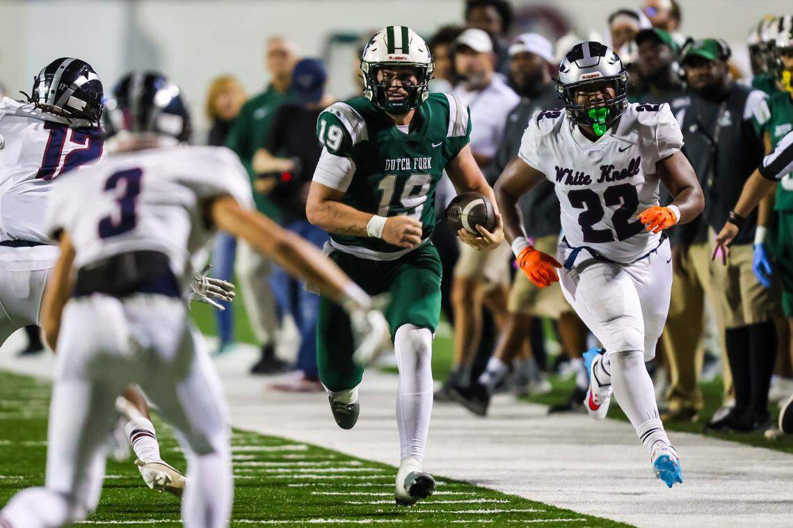 Dutch Fork Silver Foxes QB Jon Hunt (19) rushes for a long gain against the White Knoll Timberwolves during the 5A State Championship Game Friday, Dec. 1, 2023, at South Carolina State’s Oliver Dawson Stadium in Orangeburg, SC.