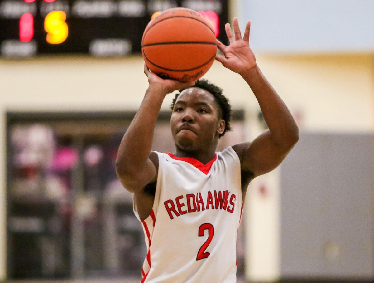 Westwood Redhawks guard Russell Jones Jr. (2) shoots a free throw during their game.
