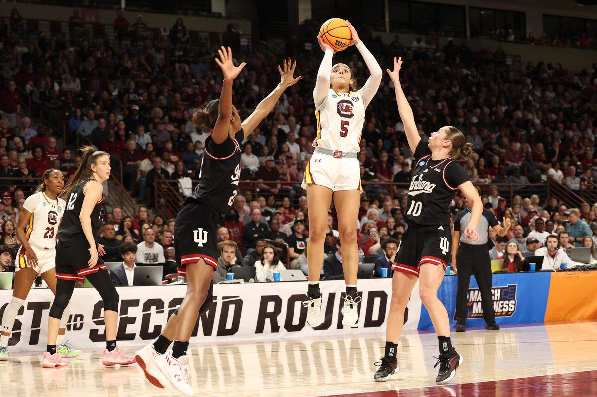 University of South Carolina’s Tessa Johnson (5) shoots as Indiana University’s Julianna LaMendola (20) and Indiana University’s Shay Ciezki (10) pressure during the first half of action in the Second Round game of the NCAA Tournament at the Colonial Life Arena on Sunday, March 23, 2025.
