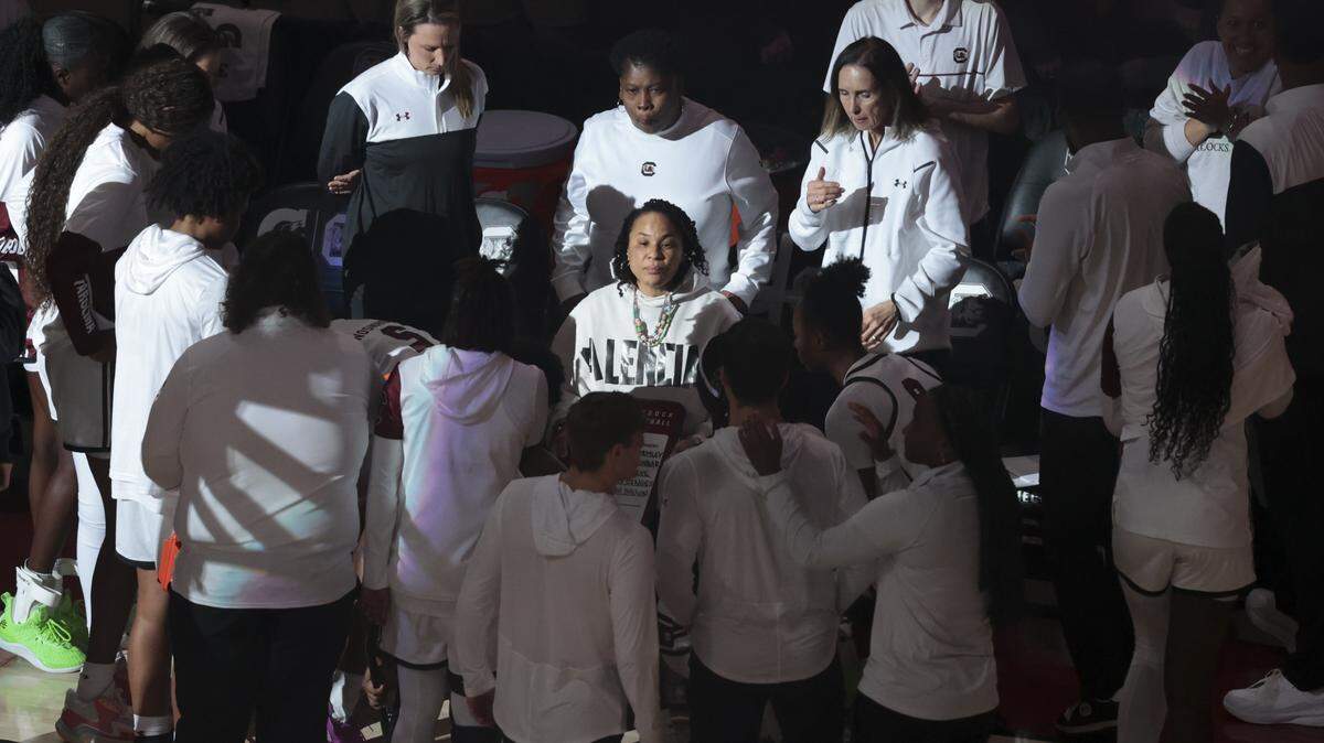 South Carolina's head coach Dawn Staley huddles with her players before their women's basketball game against Providence at Colonial Life Arena on Sunday, Dec. 28, 2025.