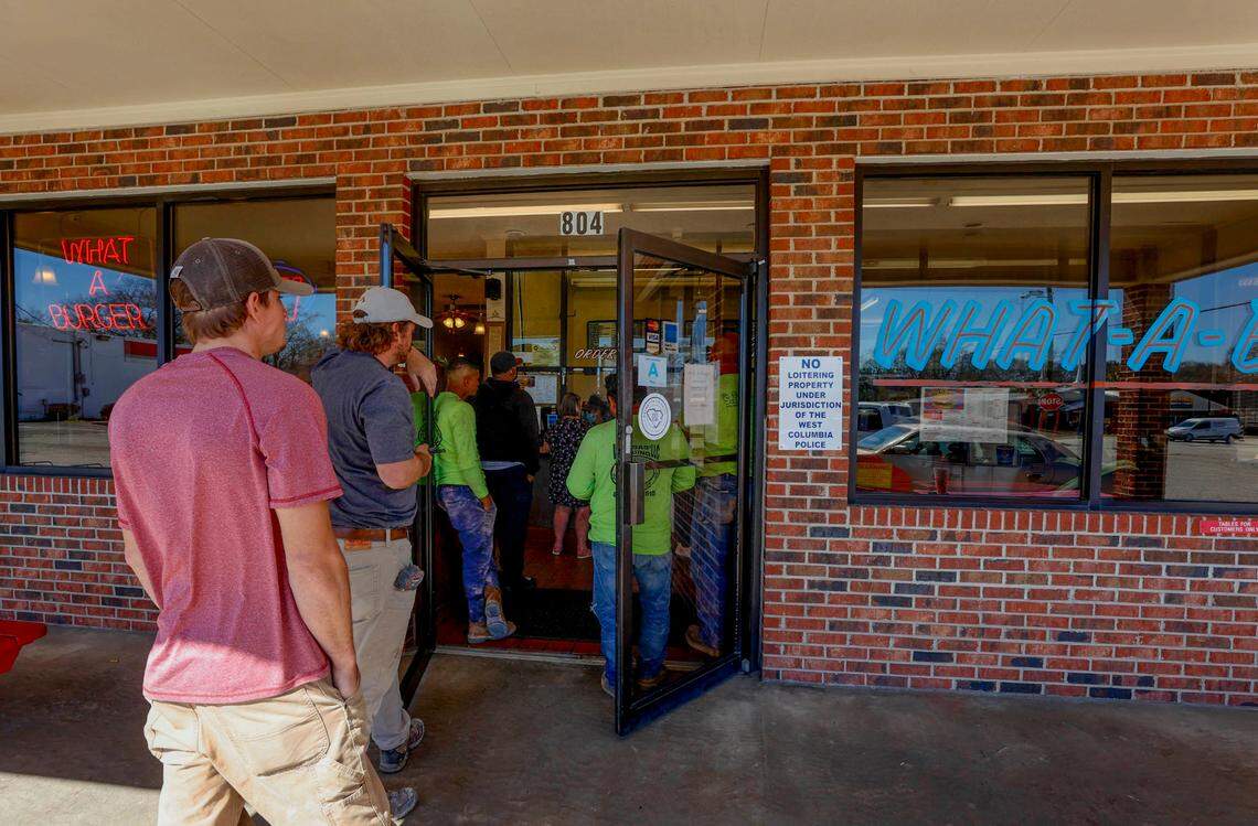People wait in line outside the The What-a-Burger in West Columbia to order. The restaurant has been open on Meeting Street since 1953.
