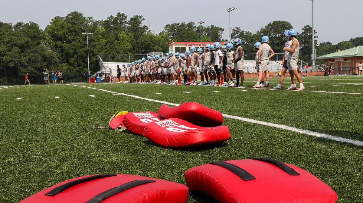 A high school team takes to the field for the first day of football practice. Former professional soccer player Brandon Miller says that in North Carolina schools need adequate funding to offer robust sports programs, facilities and equipment for all.