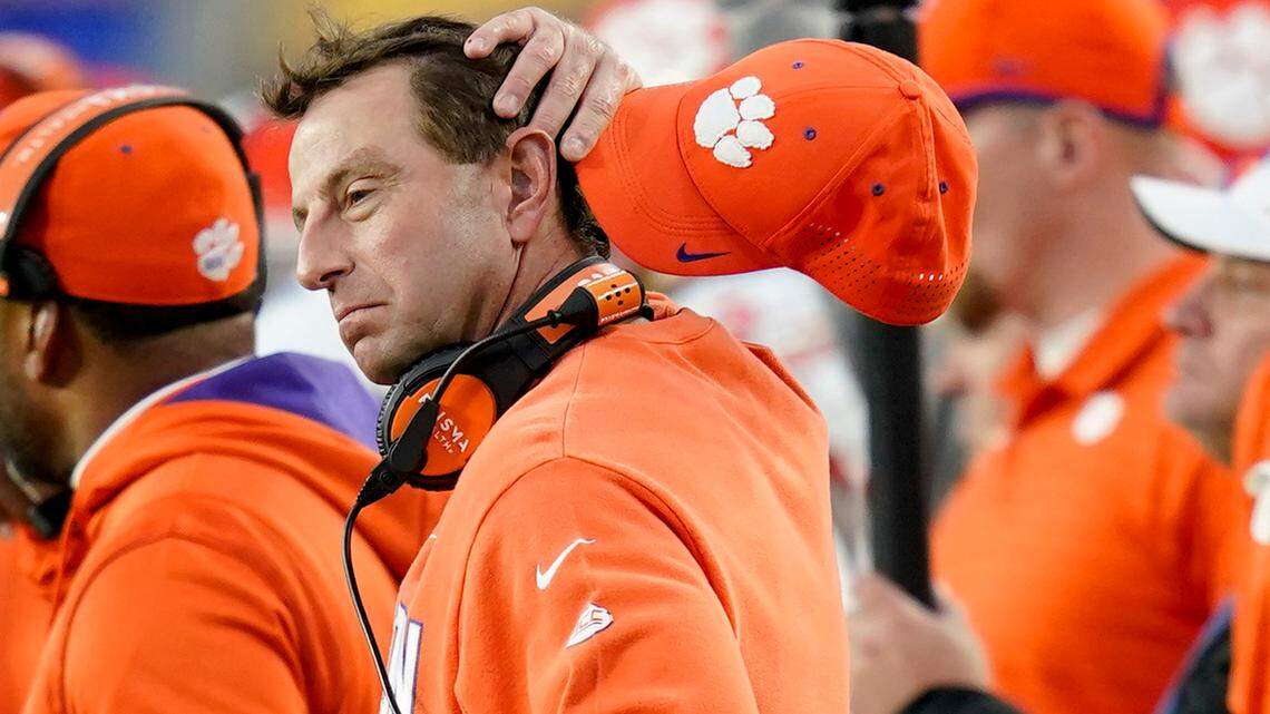 Clemson head coach Dabo Swinney wipes his head as he watches as his team play against Pittsburgh in the second half of an NCAA college football game, Saturday, Oct. 23, 2021, in Pittsburgh. Pittsburgh won 27-17. (AP Photo/Keith Srakocic)