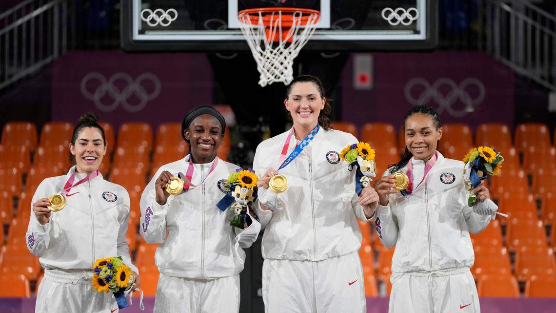 Members of team United States, from left to right, Kelsey Plum, Jacquelyn Young, Stefanie Dolson and Allisha Gray pose with their gold medals during the awards ceremony for women’s 3-on-3 basketball at the 2020 Summer Olympics, Wednesday, July 28, 2021, in Tokyo, Japan. (AP Photo/Jeff Roberson)